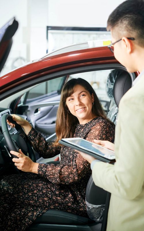 woman-and-salesman-in-car-showroom-1.jpg