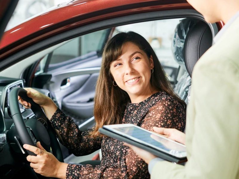 woman-and-salesman-in-car-showroom-1.jpg